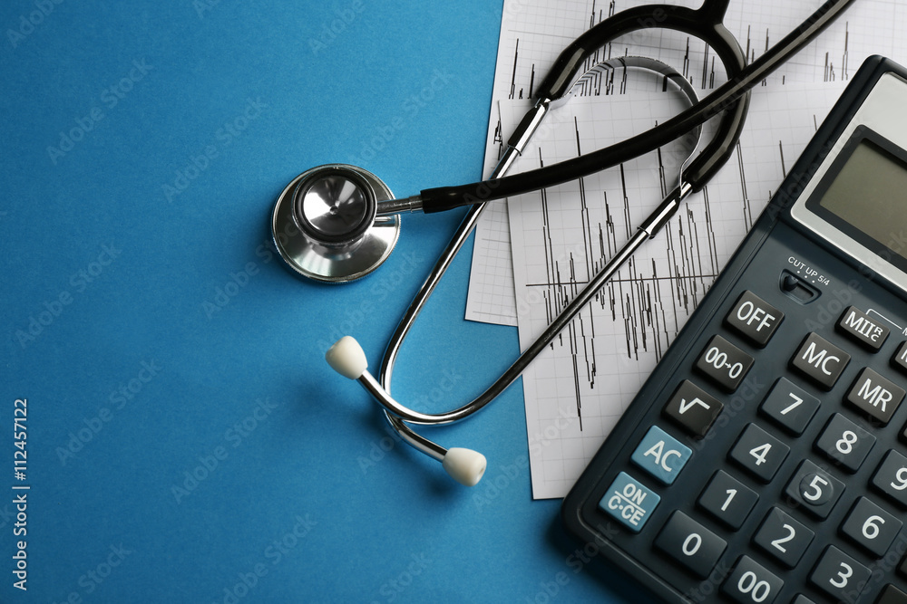 Medical concept. Cardiogram with  stethoscope on blue background