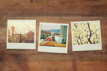 Wall Mural - top view of instant photos album on wooden background