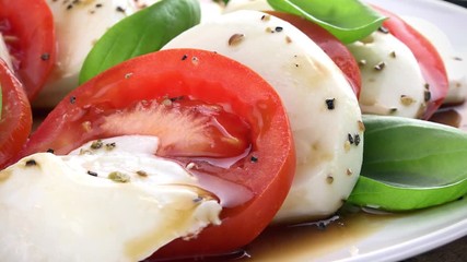 Canvas Print - Homemade Tomato Mozzarella Salad as rotating, not loopable 4K clip