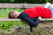 © LoloStock - Pregnant woman sleeping on bench in forest