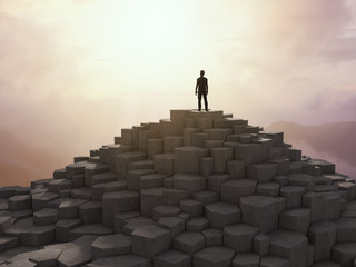 Wall Mural - tiny man on top of a mountain