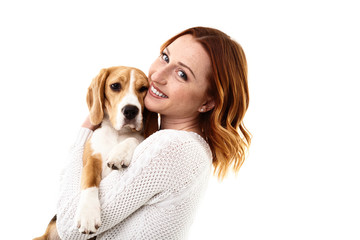 Cheerful young woman with her pretty dog