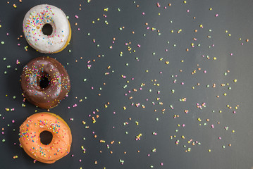 Donuts composition Place on the wooden floor A white background