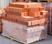 Wall  Ceramic Perforated Blocks Of Red Bricks On A Pallet