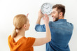 © Yakobchuk Olena - Young couple hanging wall clock