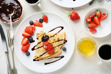 Canvas Print - crepes with berries and sauce