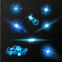 Wall Mural - Realistic glow blue light effects. Lens flare set. Realistic glowing sparkles particles effects on dark transparent grid