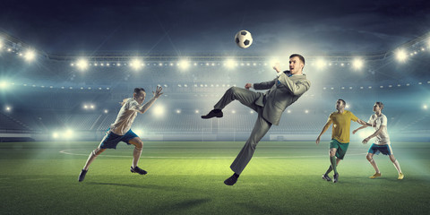 Wall Mural - Businessman and players fighting for ball