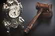 © Alex - Judges Hammer or Gavel With Old Clock On Dark Background