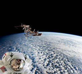 Wall Mural - planet earth astronaut spaceman helmet suit outer spacewalk international space station. elements of