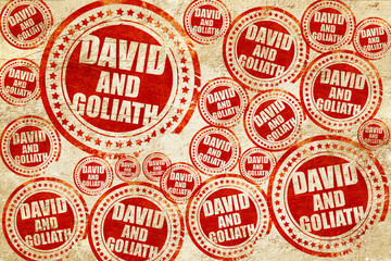 Wall Mural - david and goliath, red stamp on a grunge paper texture