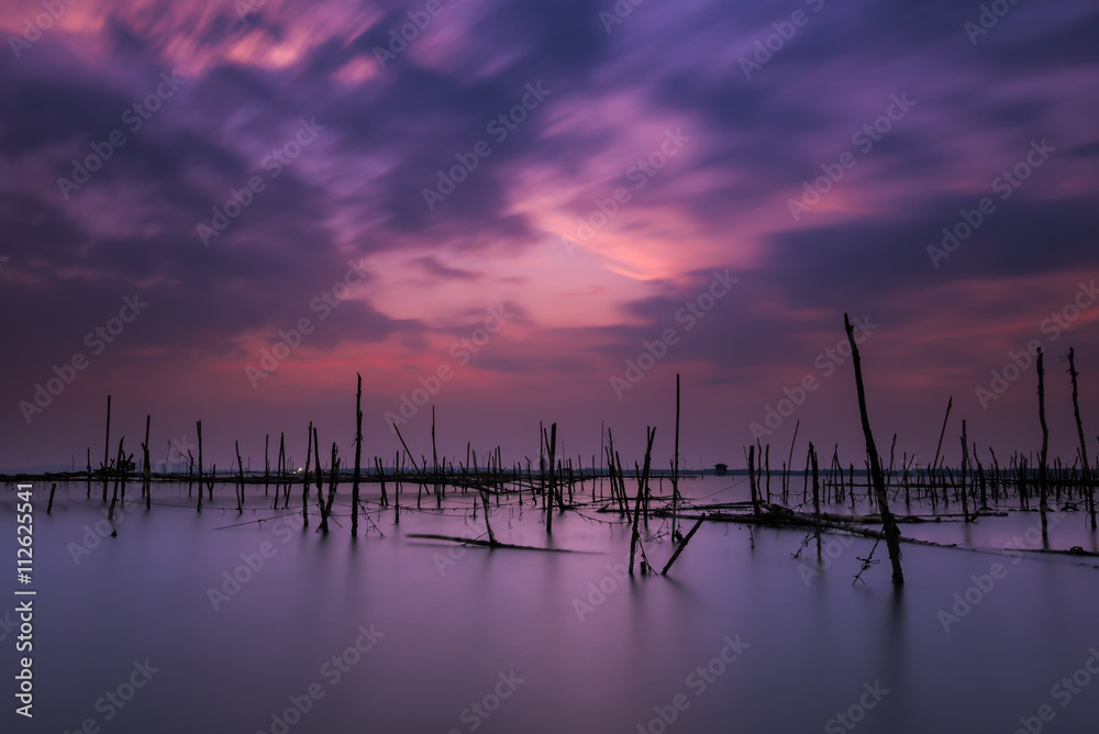 Long exposure on the beach with the oyster farms - obrazy, fototapety, plakaty 