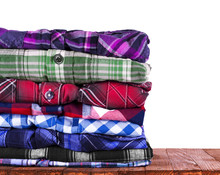Shirts Stack On Wooden Background