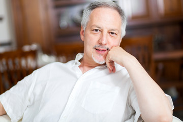     Smiling man relaxing on the couch