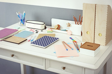 Wall Mural - Office and school set with stationery and notebooks on a table