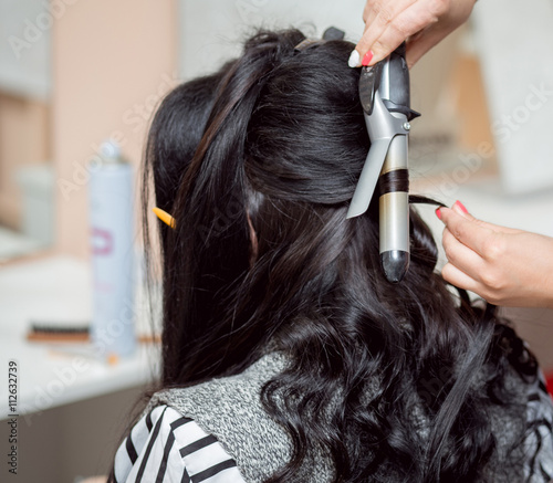 The Barber Makes An Evening Or Wedding Hairstyle With Long