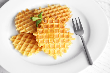 Wall Mural - Tasty waffles with honey and mint on plate