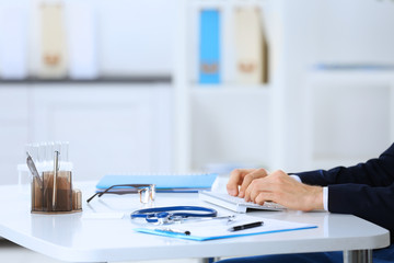 Poster - Doctor working at a computer in hospital