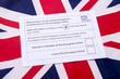 Voting ballot for the referendum on the United Kingdom's membership of the European Union leave or remain on a Union Jack British flag background