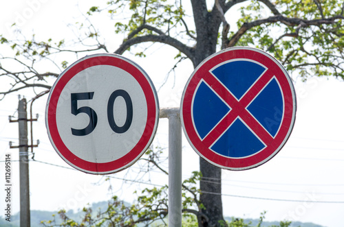 Fotografija Two paired road sign. Speed limitation.
