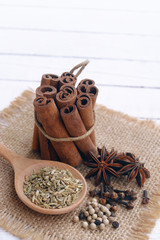 five spices to make chinese five-spice powder. five spice on wooden background.