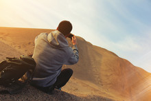 Man In The Desert Takes Photo Of Dune