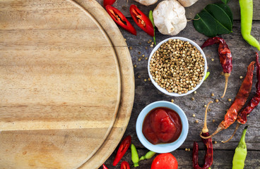 cooking concept, fresh kitchen herbs and spices on wooden table. top view and nature light [over light]