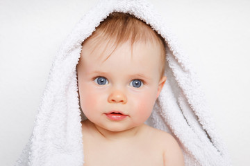 baby under a towel
