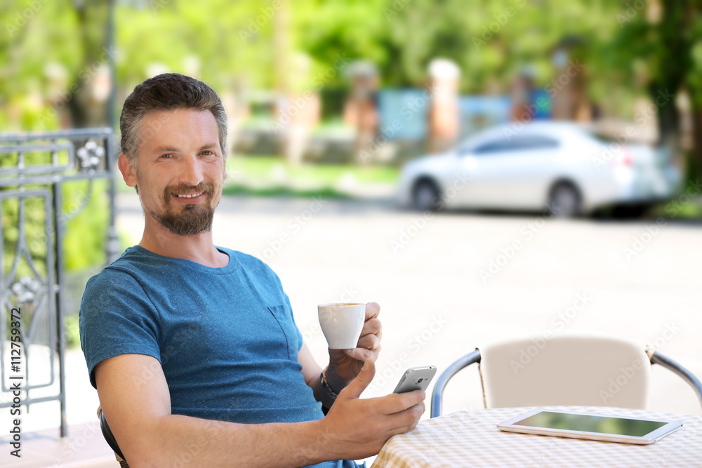 Businessman relaxing in cafe