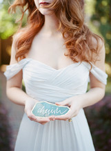 Bride Holding Sign With The Word Cherish