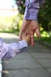 © Kostia - parent holds the hand of a small child