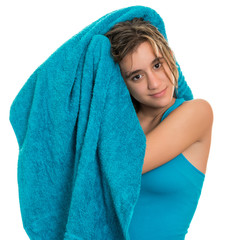 Wall Mural - Pretty teenage girl drying her wet hair  with a towel