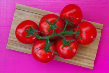 Wall Mural - Red tomatoes on the wooden table