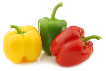 red, green and yellow pepper (capsicum) on a white background