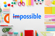 Word impossible transformed into possible and school supplies