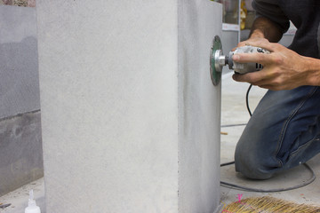 Man polishing marble stone table 