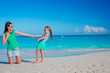 © travnikovstudio - Mother and daughter enjoying time at tropical beach