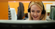 © Myvisuals - Attractive young woman in suit sitting at call center office and