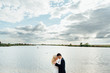 © ruslan_shramko - Bride and groom walking at the river