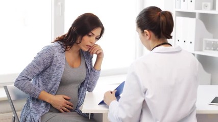 Poster - gynecologist and pregnant woman at hospital