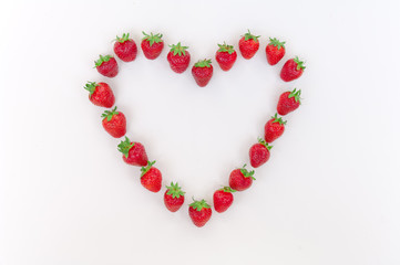 Wall Mural - Heart shaped strawberries on white background strawberry heart