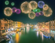 Beautiful fireworks under Grand Canal and buildings in Venice