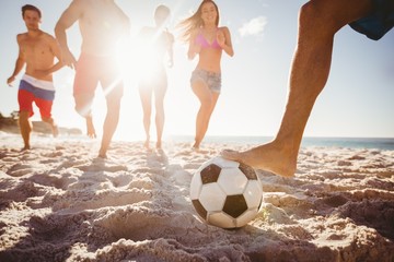 Friends playing football