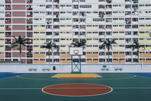 Urban Oasis - Basketball Court On A Pastel Skyscraper Front.