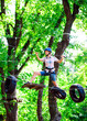 © davit85 - adventure climbing high wire park - people on course in mountain