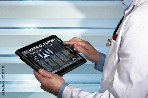 Fotografía doctor with tablet data consulting a medical report of a patient / practitioner