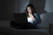 © Wordley Calvo Stock - attractive relaxed woman at home sitting happy on couch using laptop at night