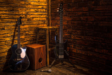 Cajon, Bass And Acoustic Guitar On Wooden Stage In Pub