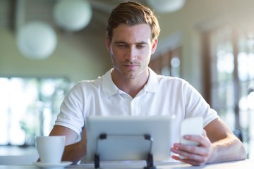 Poster - Man using digital tablet