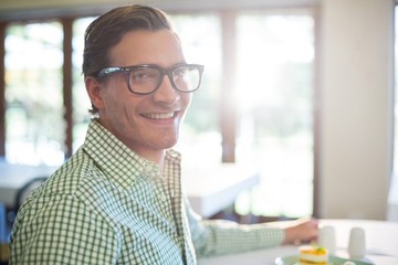 Poster - Portrait of smiling man having a lunch